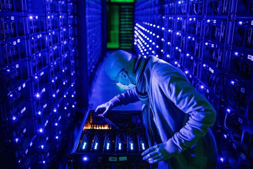 An inside look at a Bitcoin miner undergoing repair, emphasizing the components critical for hashrate restoration