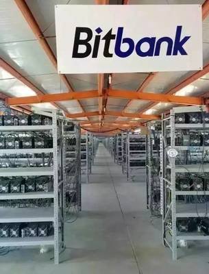Nevada solar-powered mining farm with rows of miners under solar panels